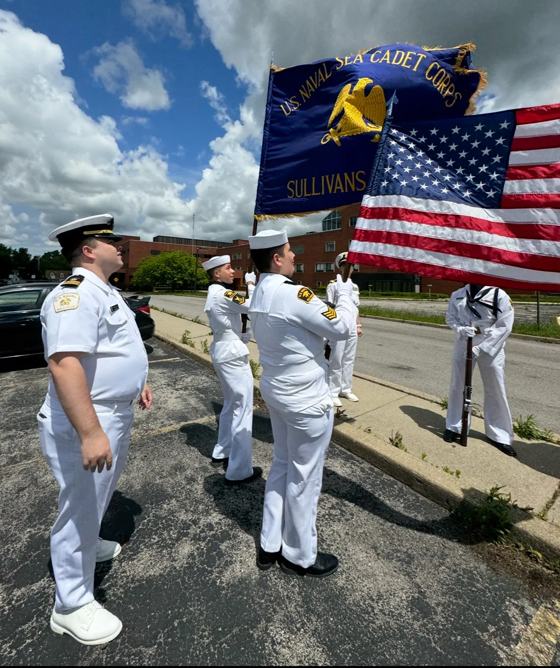 The Sullivans Division color guard in white dress uniforms